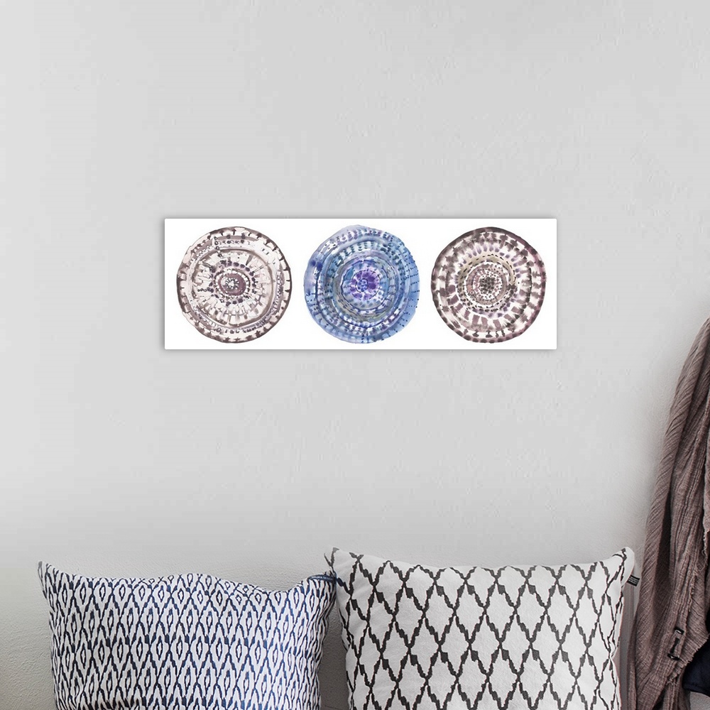 A bohemian room featuring Three circular watercolor shapes with swirls and patterns.