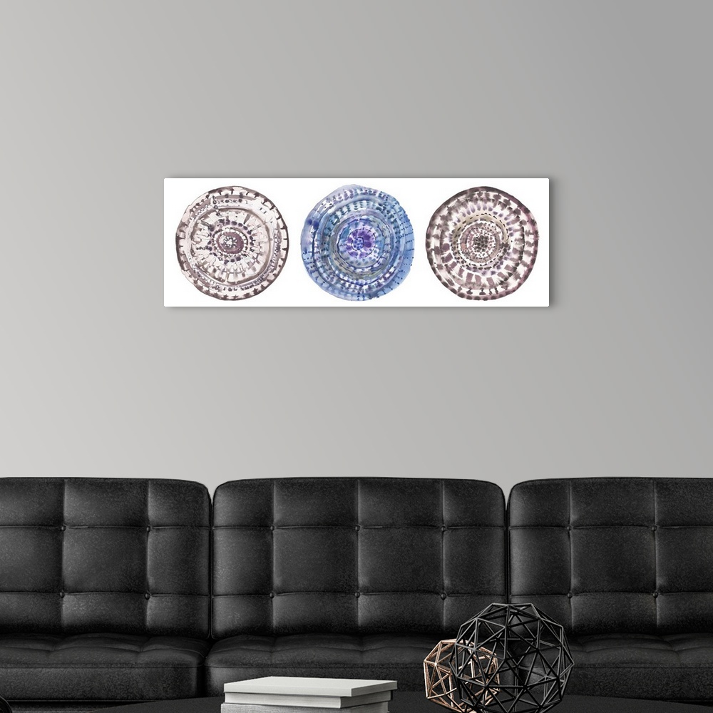 A modern room featuring Three circular watercolor shapes with swirls and patterns.