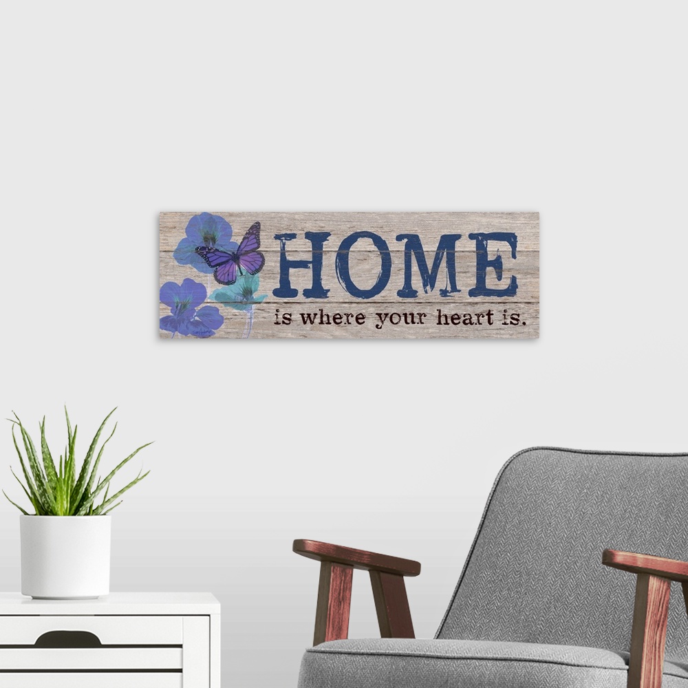 A modern room featuring Contemporary family art using flowers and typography on a rustic looking wooden surface.