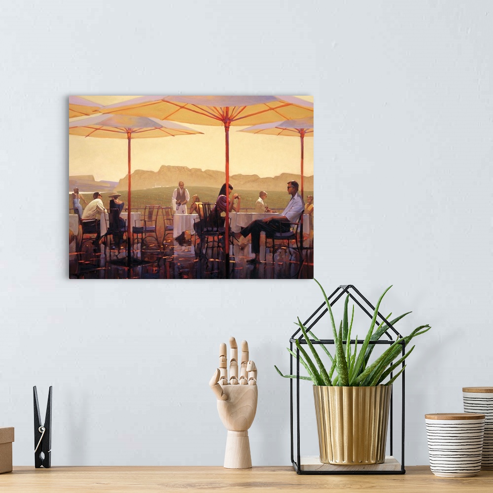 A bohemian room featuring Contemporary painting of people sitting at table on terrace overlooking vineyards.