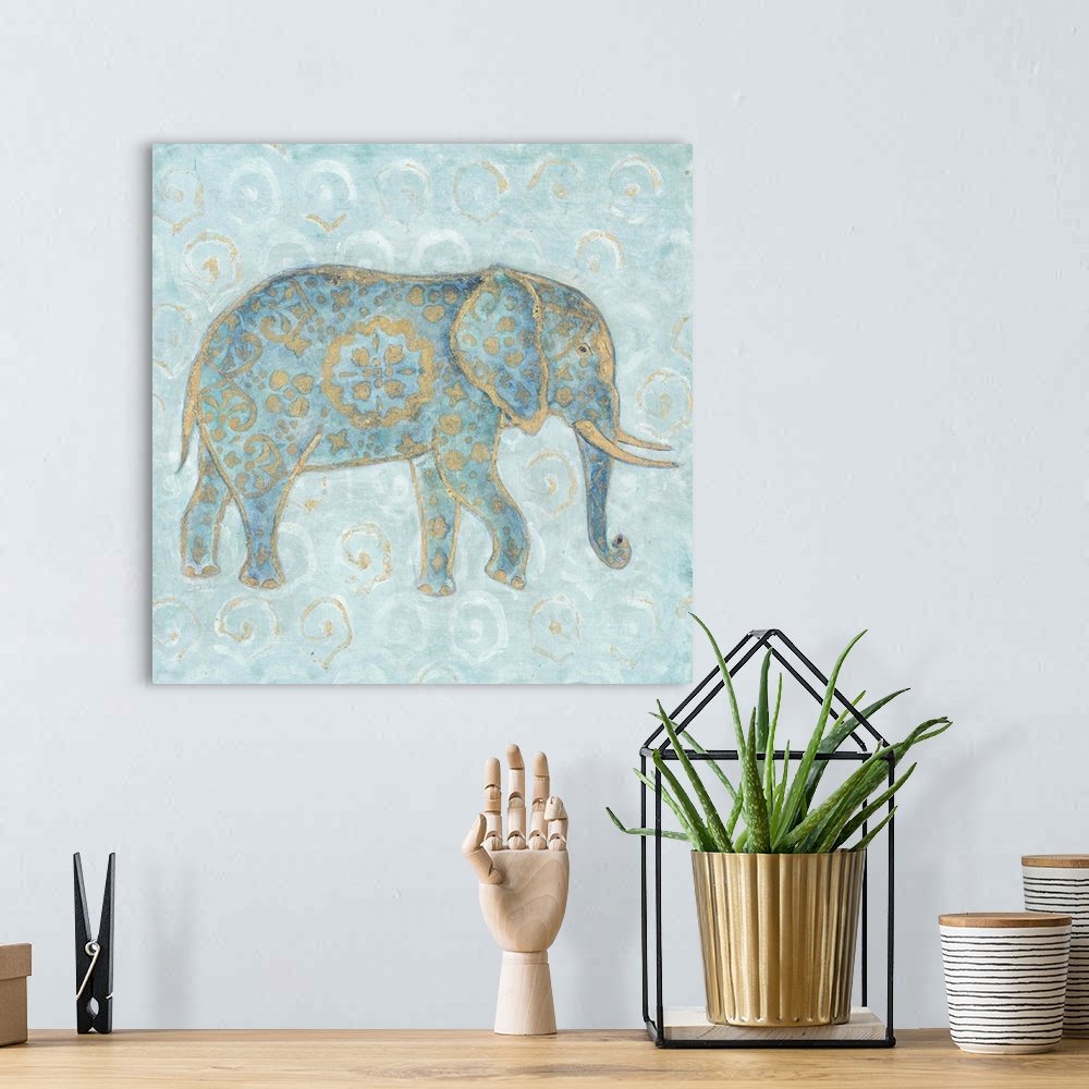 A bohemian room featuring Artwork of an Indian Elephant in blue with a golden design on a pale blue patterned background.