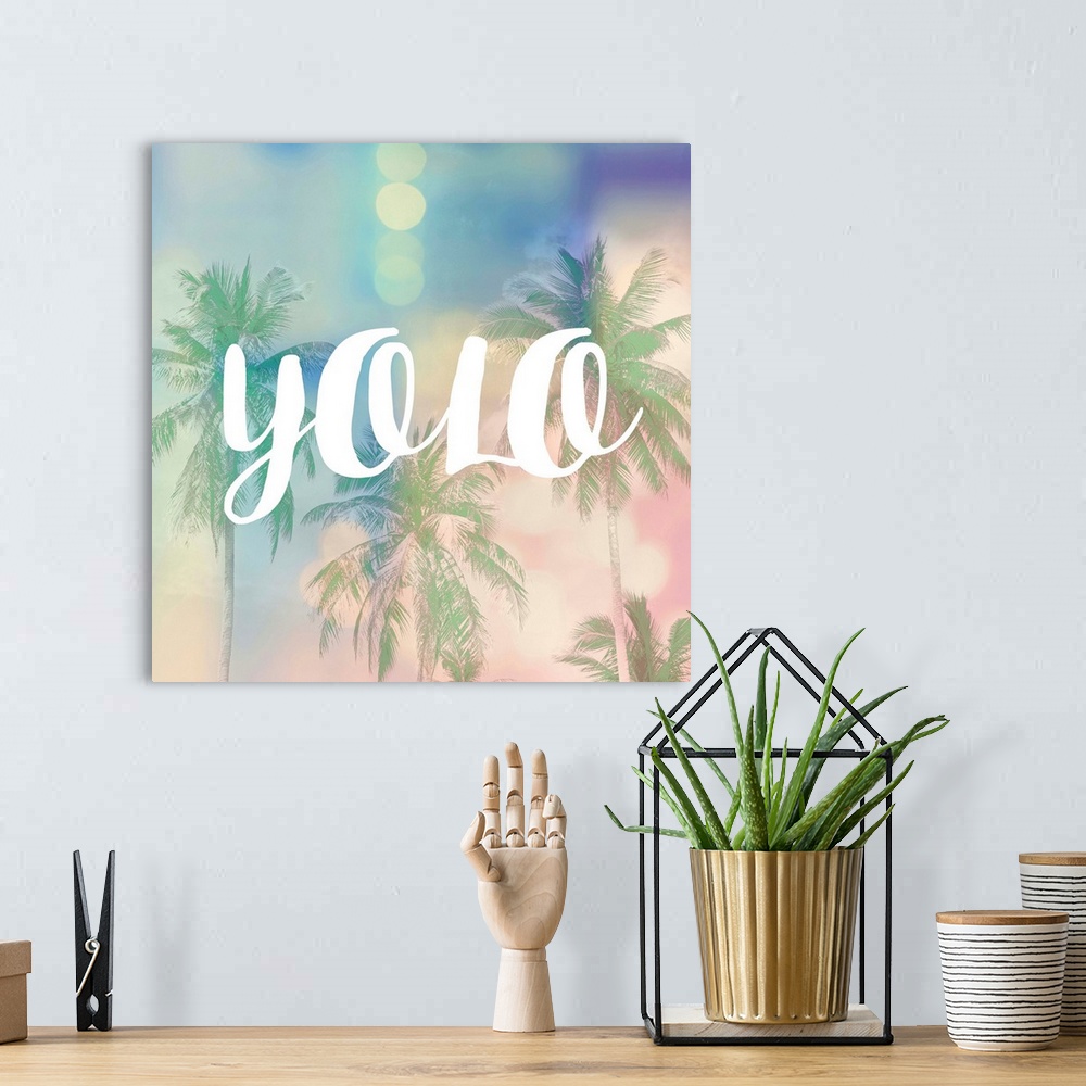 A bohemian room featuring The text "YOLO" in white over a pastel image of palm trees and bokeh lights.