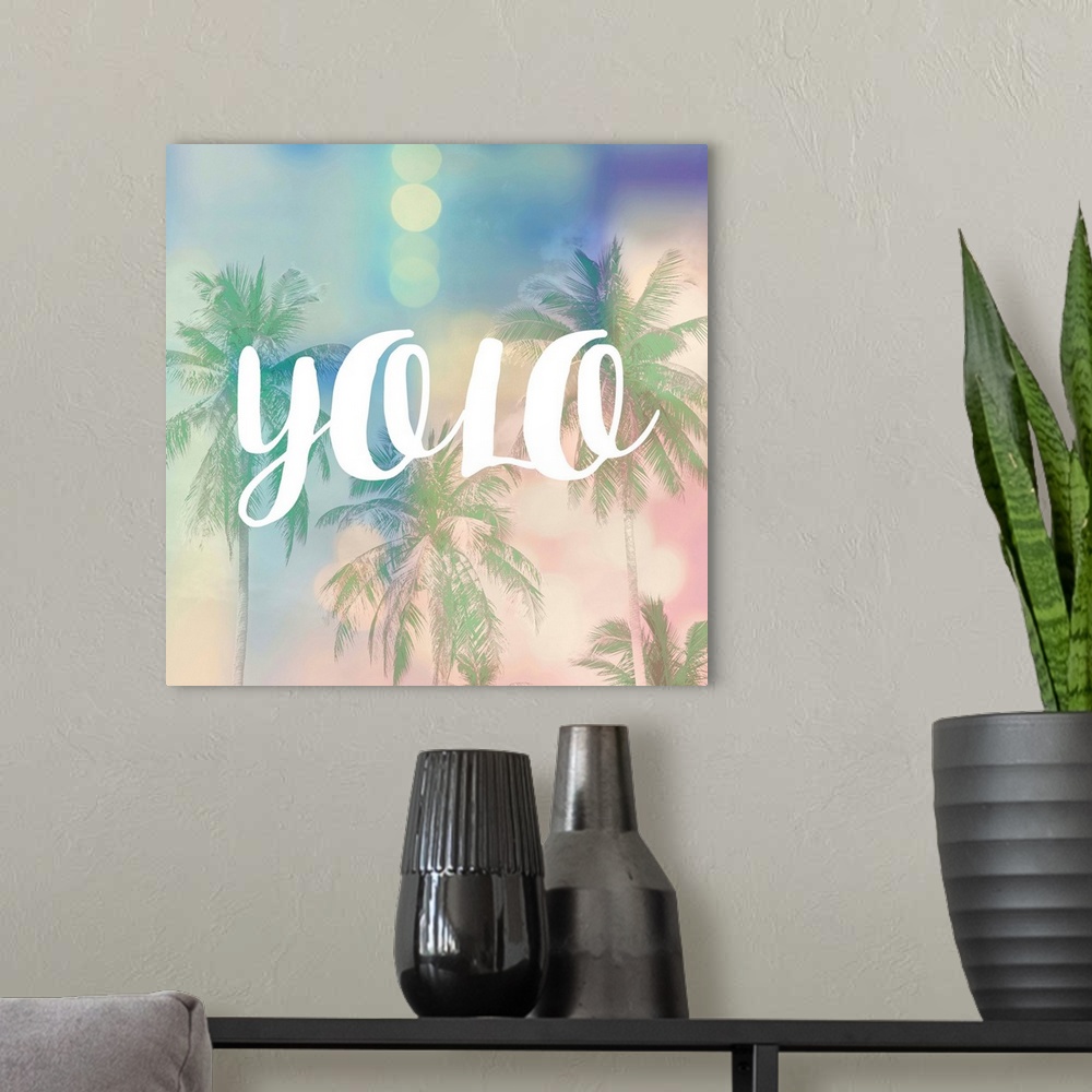 A modern room featuring The text "YOLO" in white over a pastel image of palm trees and bokeh lights.