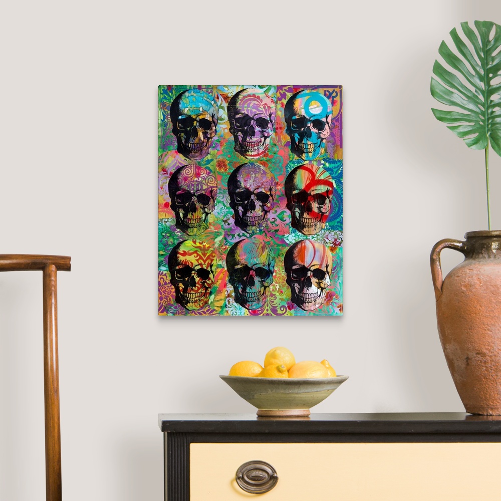 A traditional room featuring 9 skulls in three rows with colorful abstract designs all over.