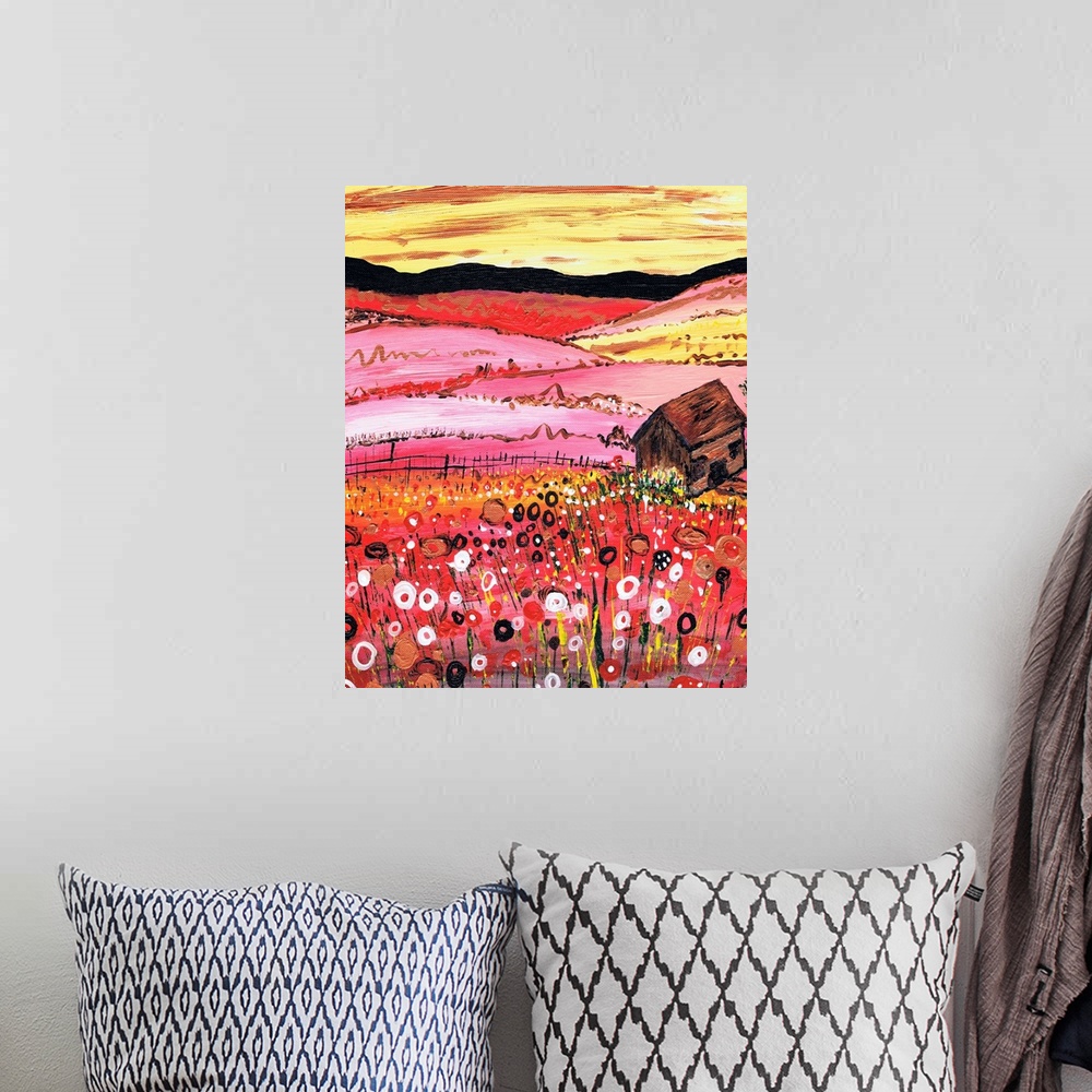 A bohemian room featuring A painting of a red field of flowers with a cottage in the foreground.
