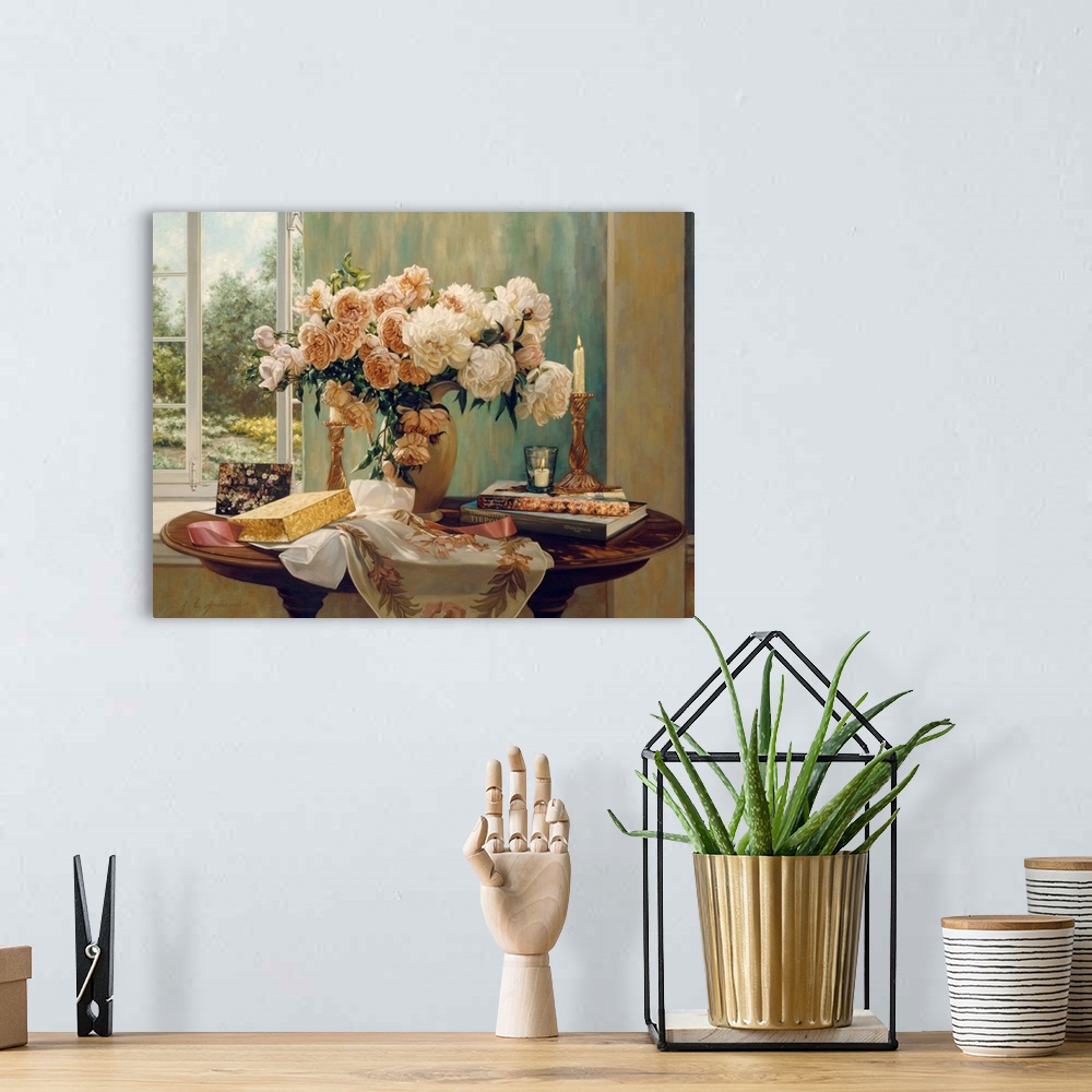 A bohemian room featuring A vase of white and peach flowers on a wooden table with two books on one side and a note card an...