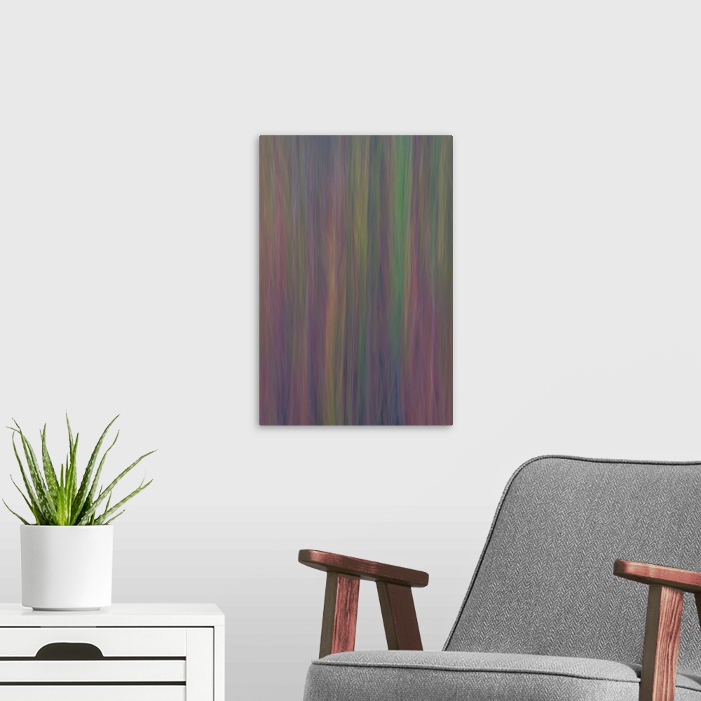 A modern room featuring Colorful abstract photograph with thin, vertical, pastel lines.
