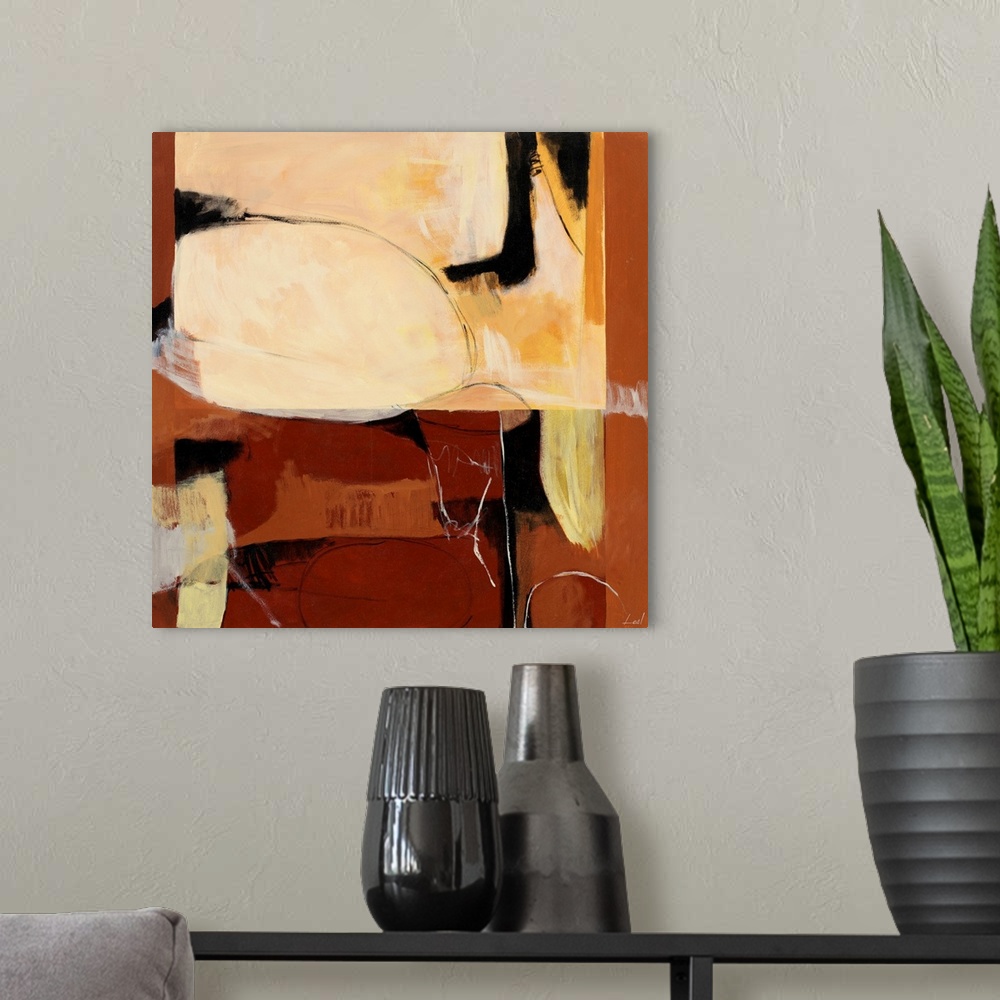 A modern room featuring Abstract painting with shapes of faces in shades of whites and browns.