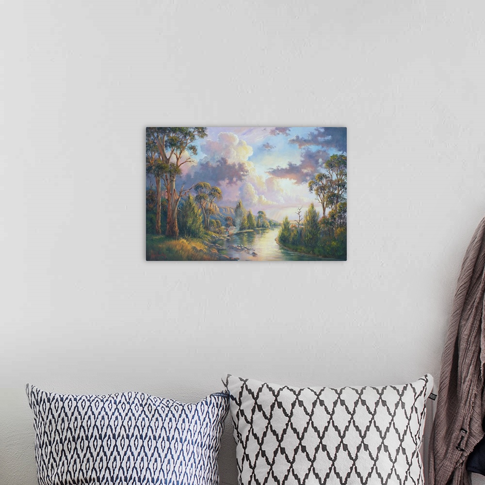 A bohemian room featuring Contemporary painting of an idyllic river scene with massive clouds hovering overhead.