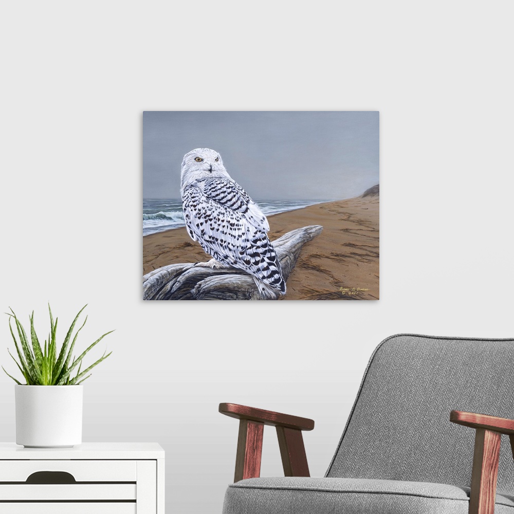 A modern room featuring Contemporary painting of a snowy owl perched on driftwood on a beach.