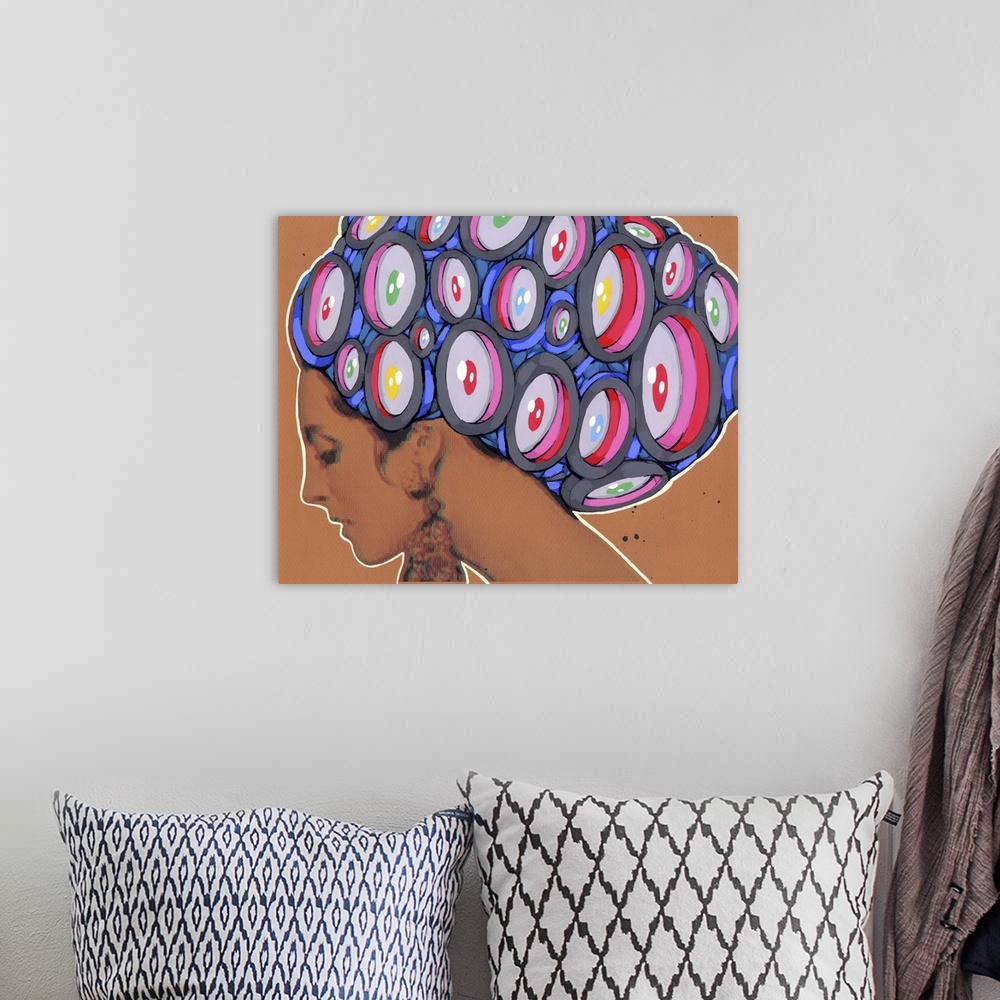 A bohemian room featuring Pop art painting of a woman with large staring eyes in her hair.