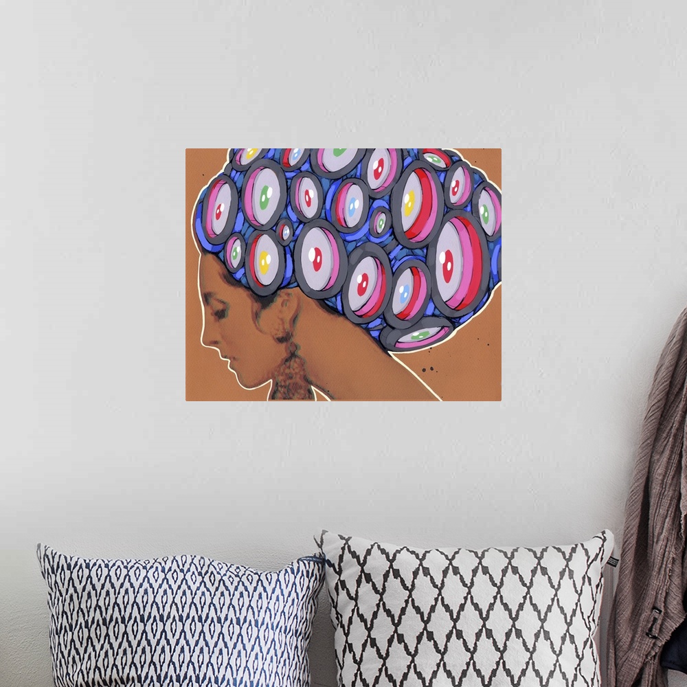 A bohemian room featuring Pop art painting of a woman with large staring eyes in her hair.