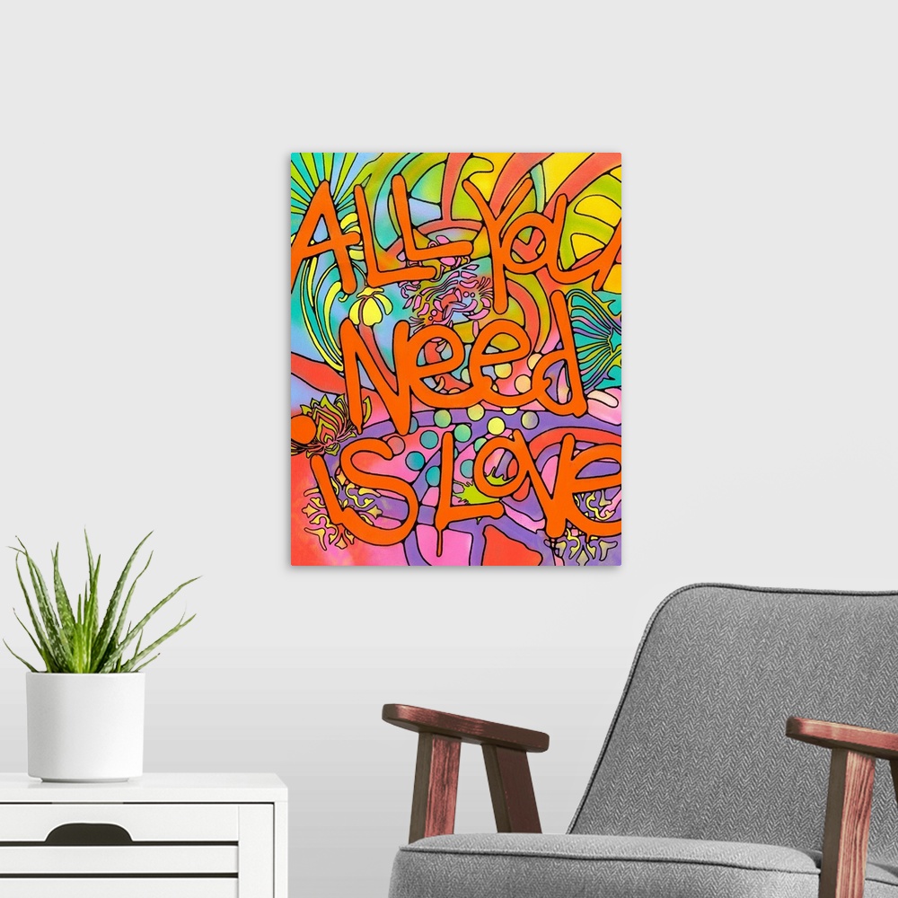 A modern room featuring "All You Need is Love" Written in orange bubble letters with paint drips on top of a colorful bac...