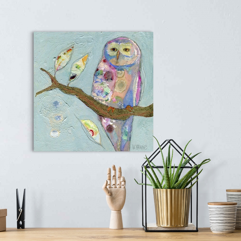 A bohemian room featuring A pastel colored owl sitting on a branch.