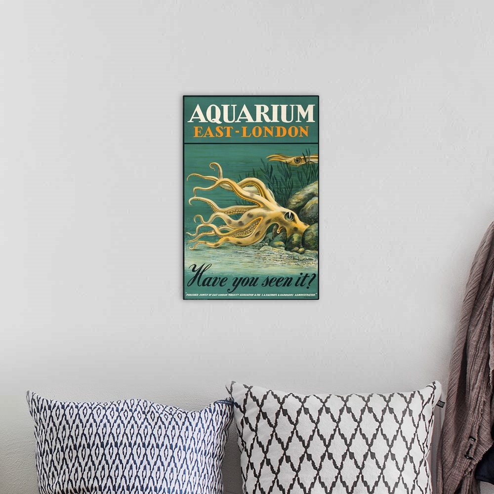 A bohemian room featuring Vintage poster advertisement for Aquarium East London.
