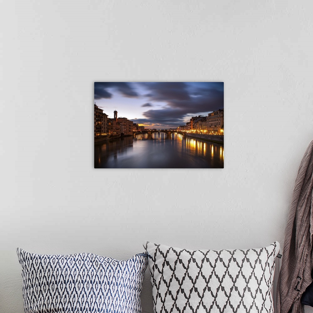 A bohemian room featuring Arno, city with lights reflecting from the bridge