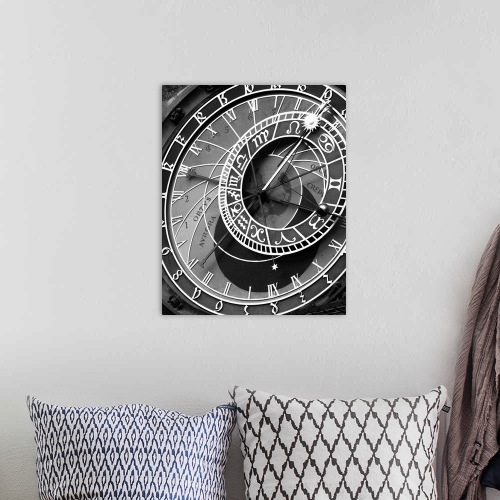 A bohemian room featuring zodiac, clock, architectural, black and white photograph