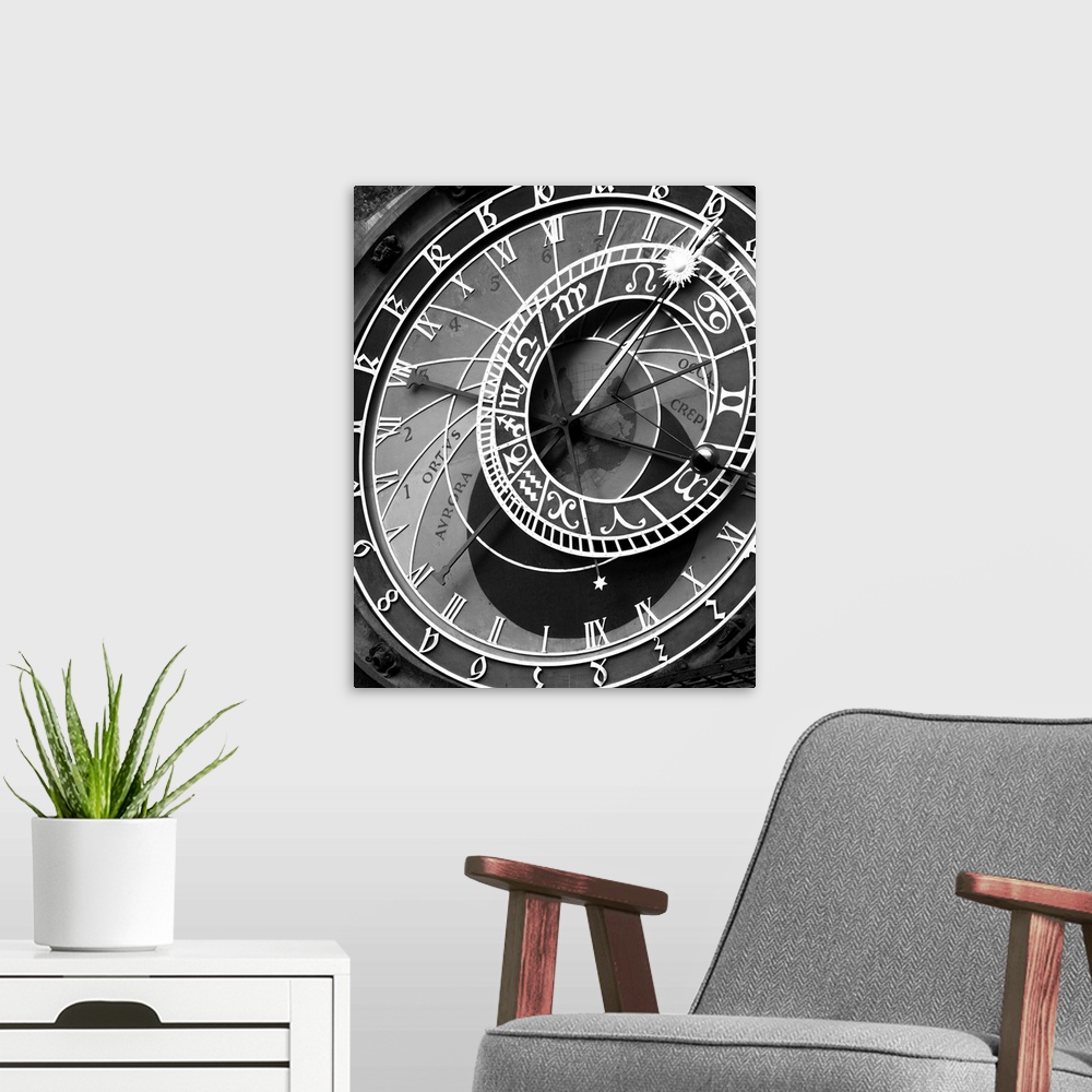 A modern room featuring zodiac, clock, architectural, black and white photograph