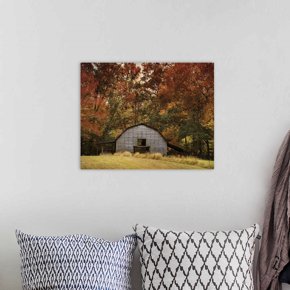 A bohemian room featuring Fine art photo of a round barn in a forest in the fall.