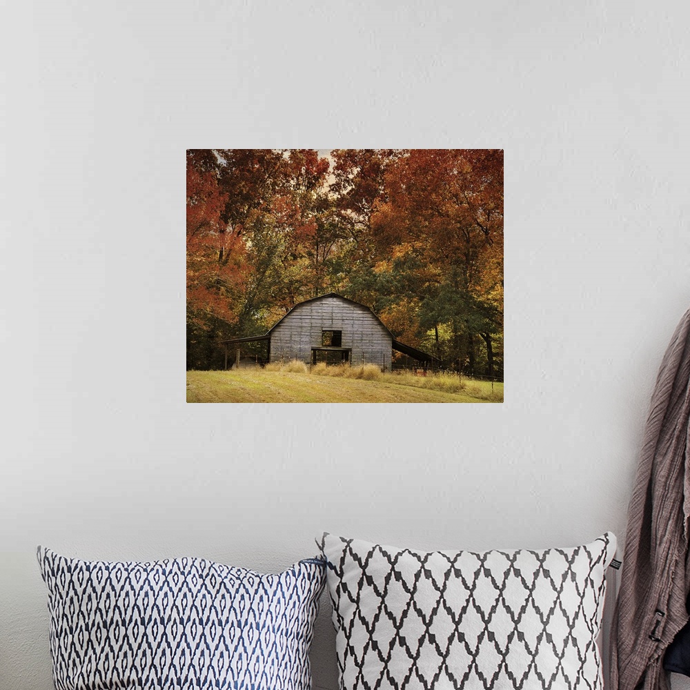 A bohemian room featuring Fine art photo of a round barn in a forest in the fall.
