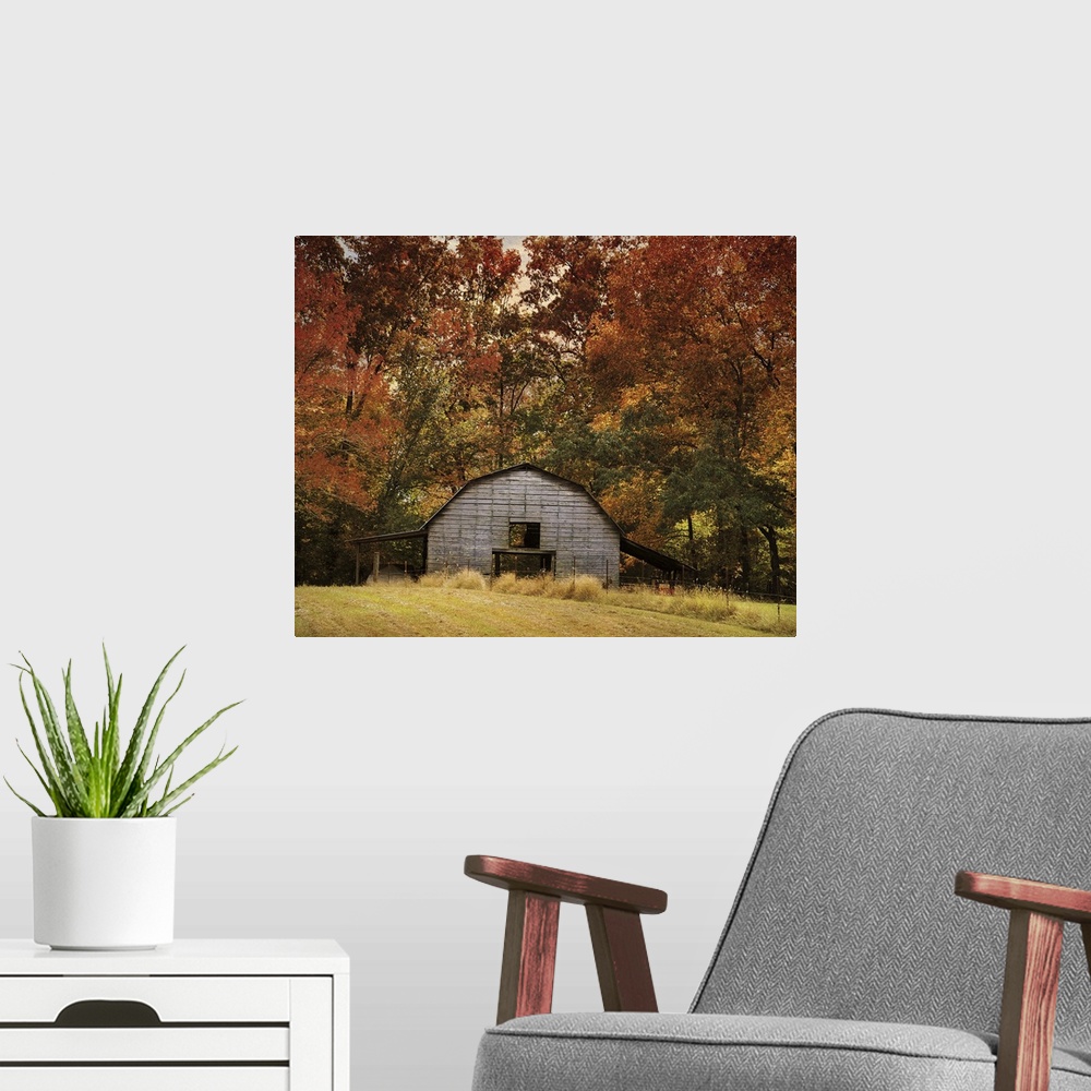 A modern room featuring Fine art photo of a round barn in a forest in the fall.