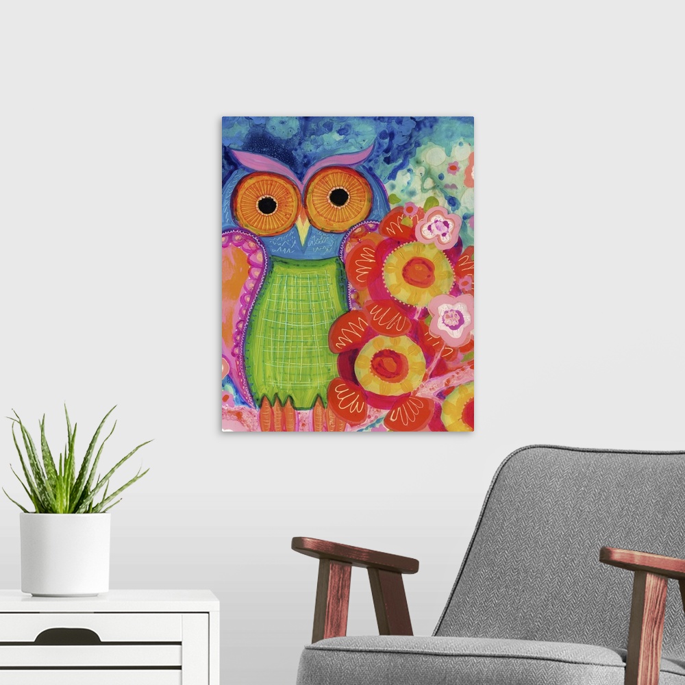 A modern room featuring An owl with large orange eyes sitting next to red flowers.