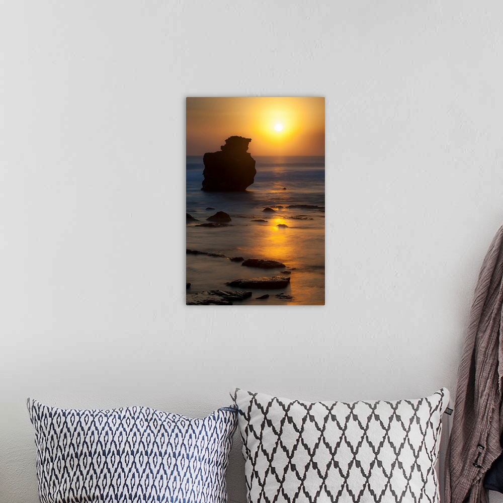 A bohemian room featuring Sunset, rocks, ocean, color photography