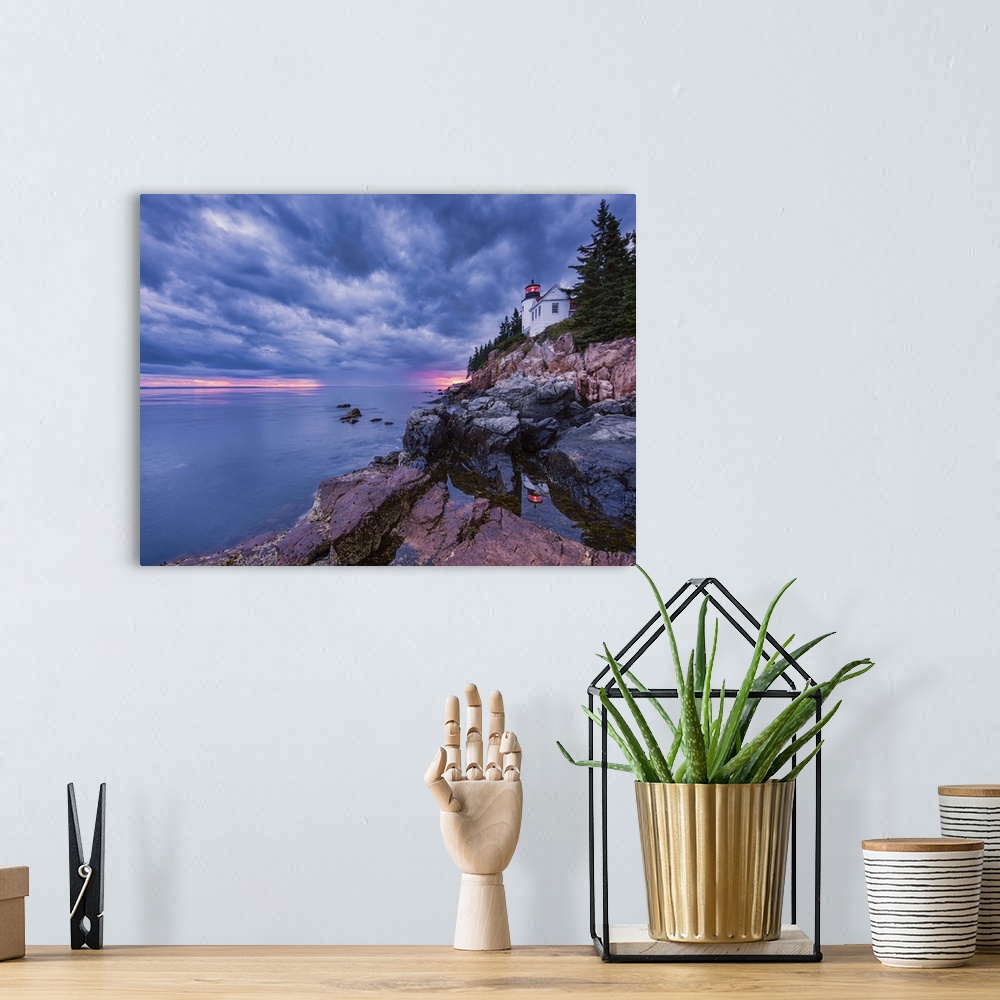 A bohemian room featuring Photograph of a white lighthouse on the coast of Maine, with the sun setting under big textured  ...