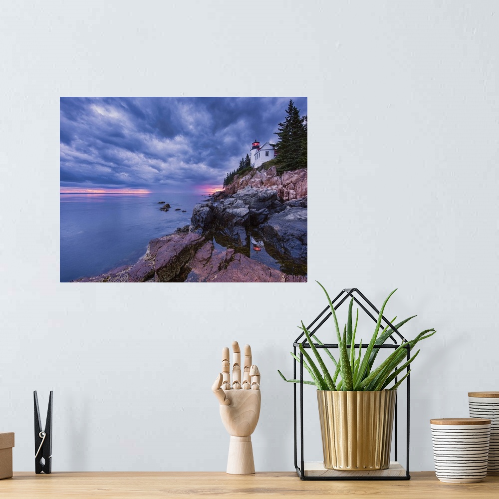 A bohemian room featuring Photograph of a white lighthouse on the coast of Maine, with the sun setting under big textured  ...