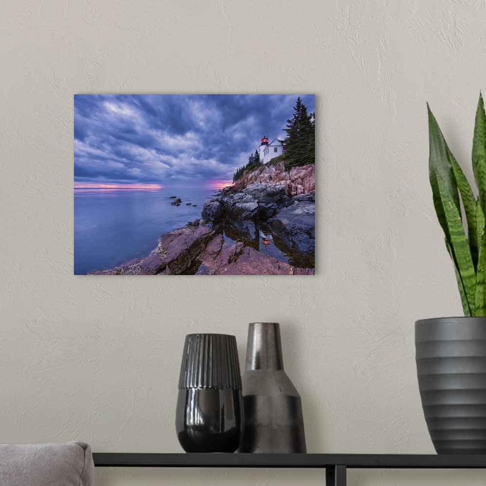 A modern room featuring Photograph of a white lighthouse on the coast of Maine, with the sun setting under big textured  ...