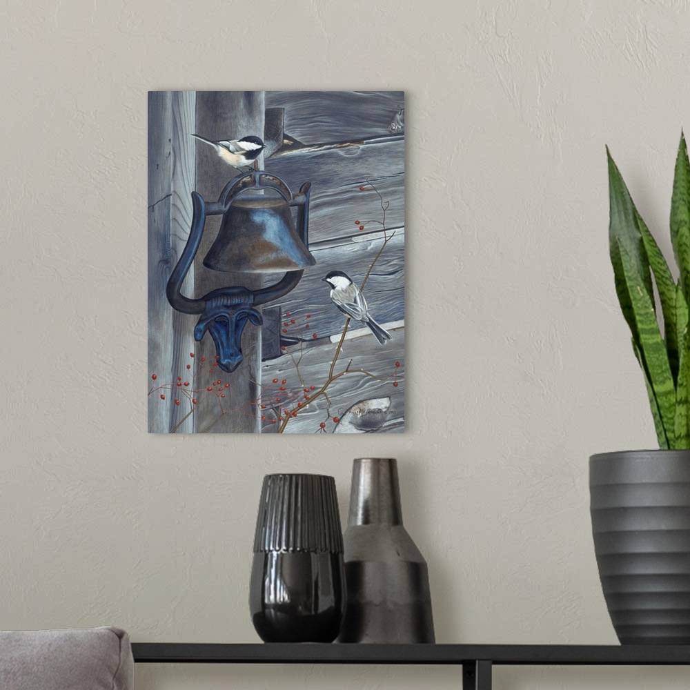 A modern room featuring Two black capped chickadees; one perched on a bell and the other on a lower branch