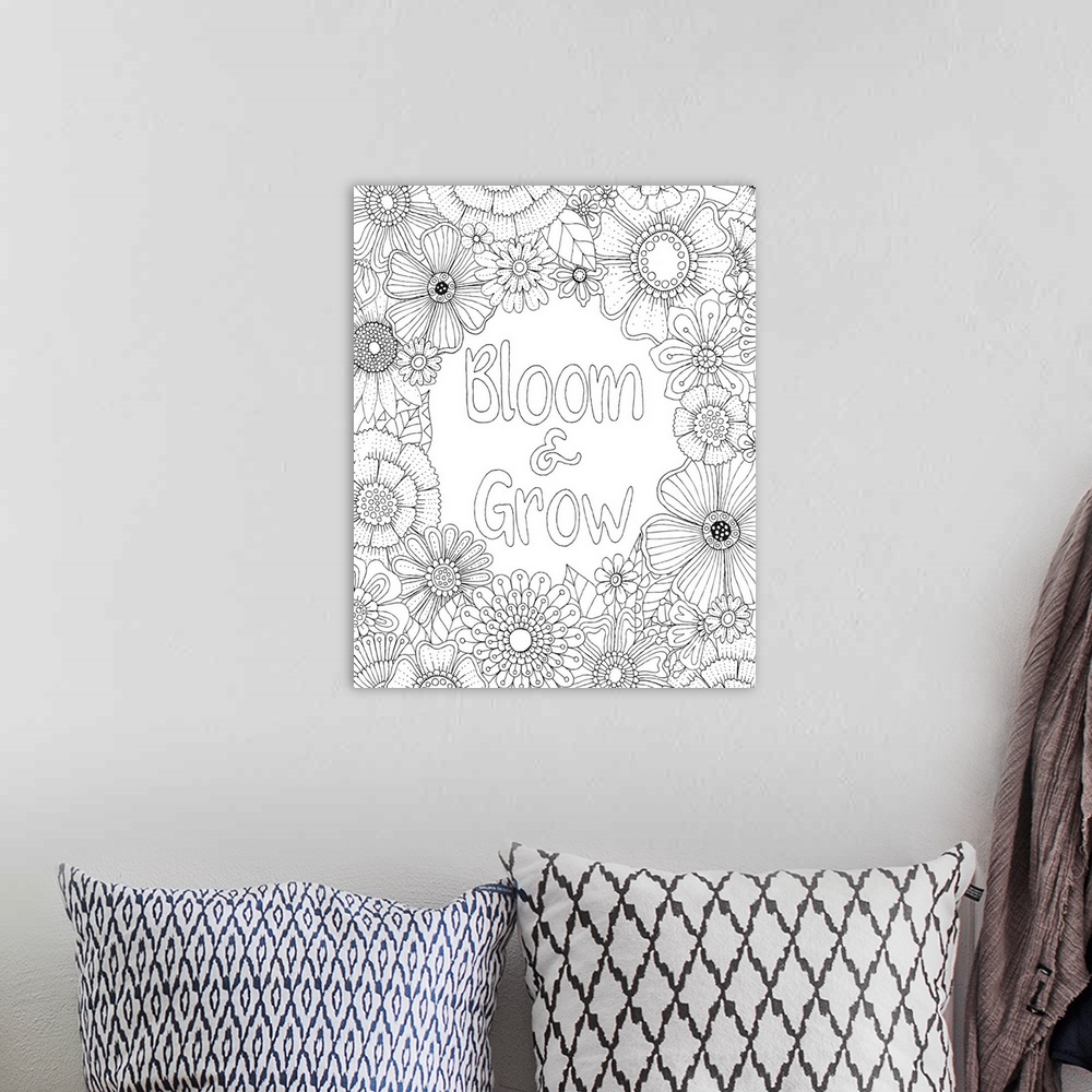 A bohemian room featuring Black and white line art with the phrase "Bloom and Grow" written in the center and surrounded by...