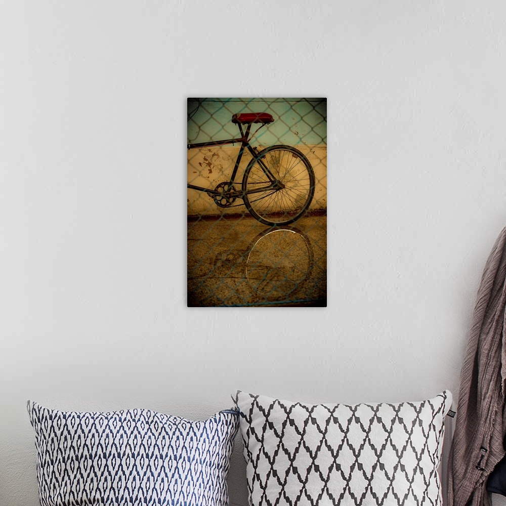 A bohemian room featuring Photograph of the rear of a bicycle behind a chain link fence with a black vignette.