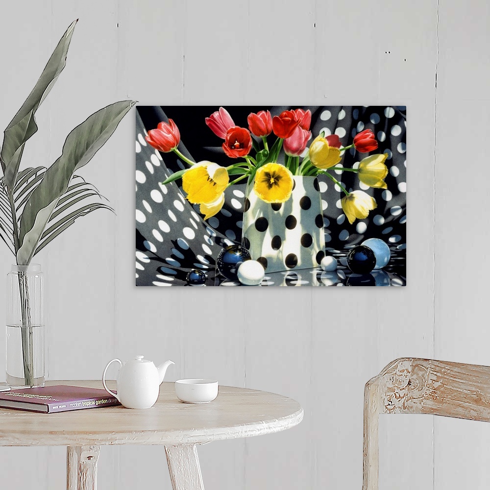 A farmhouse room featuring Contemporary vivid realistic still-life painting of red and yellow tulips sitting in a polka dott...