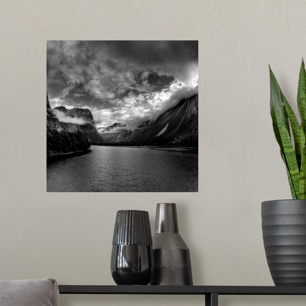 A modern room featuring Black and White Photo of mountains and wilderness