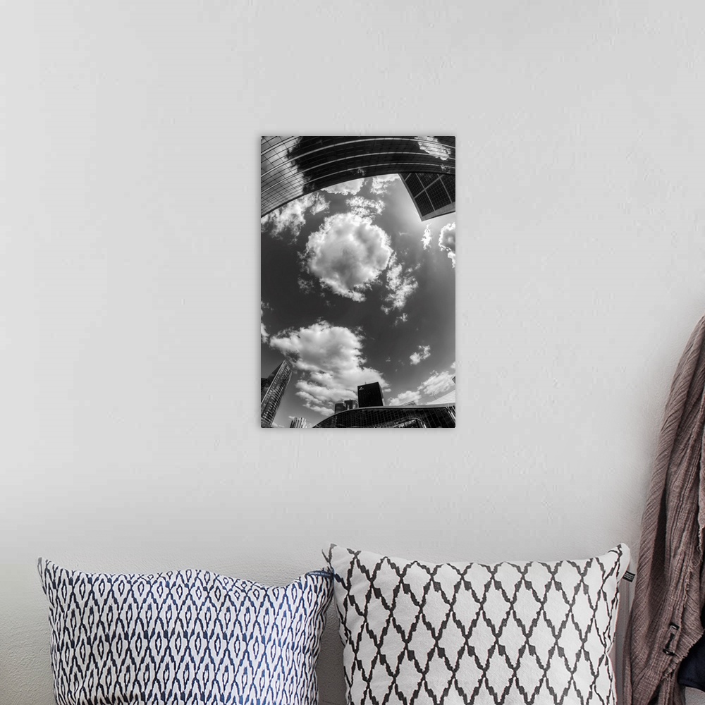 A bohemian room featuring Black and white photograph of the sky in the city