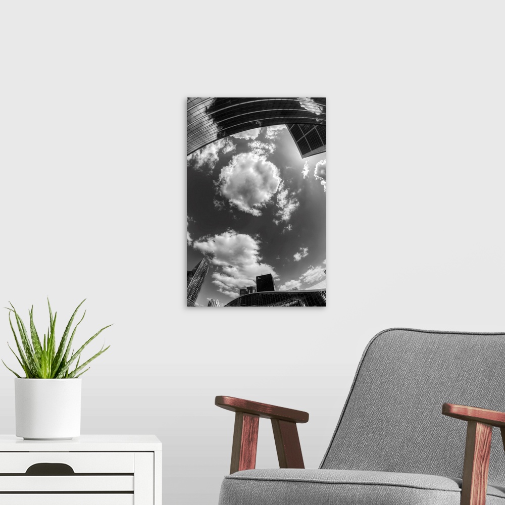 A modern room featuring Black and white photograph of the sky in the city