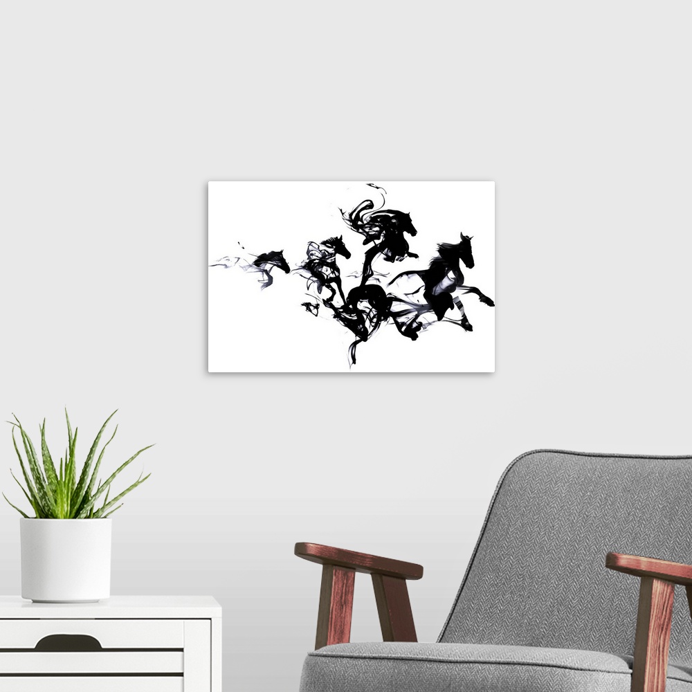A modern room featuring Contemporary artwork of black ink blotches creating the shape of galloping horses.