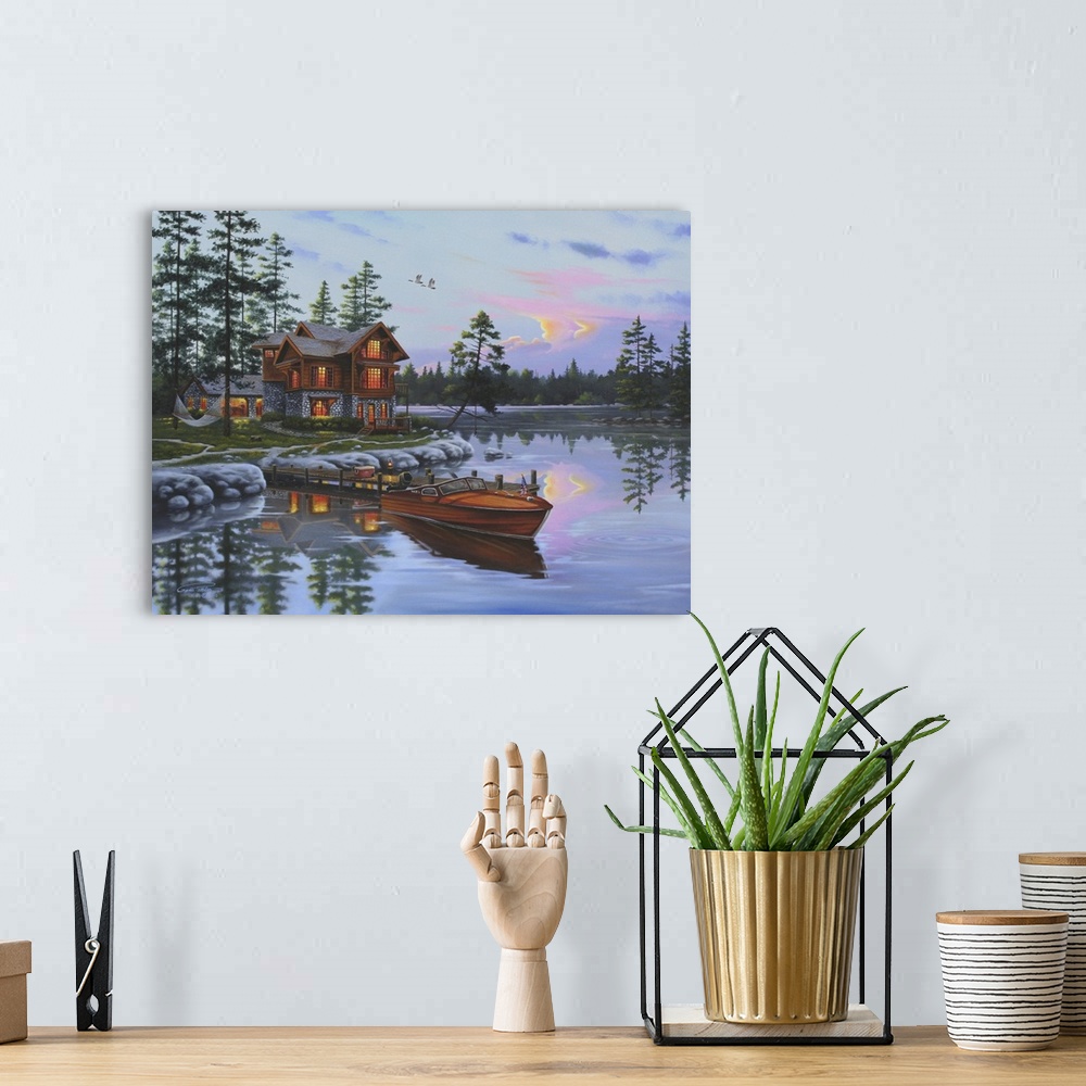 A bohemian room featuring An idyllic painting of a wilderness scene of a cabin on a lake.