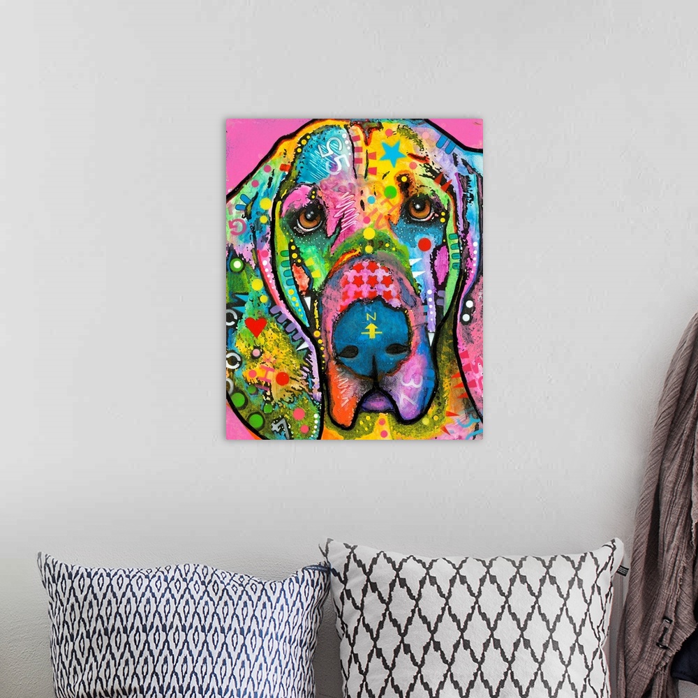 A bohemian room featuring Colorful painting of a Bloodhound with abstract markings all over on a bright pink background.