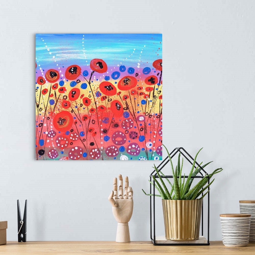 A bohemian room featuring A painting of fields filled with wildflowers.