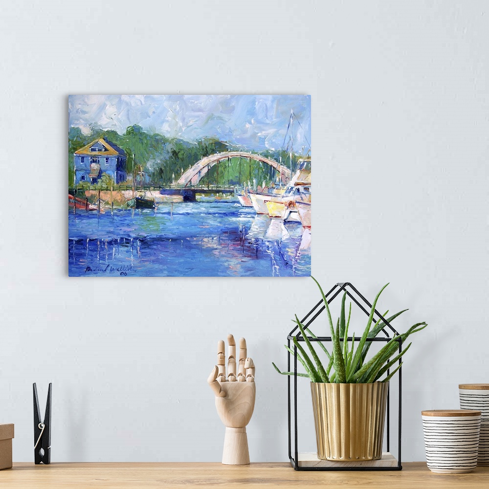A bohemian room featuring Boats in a harbor with a bridge in the background.
