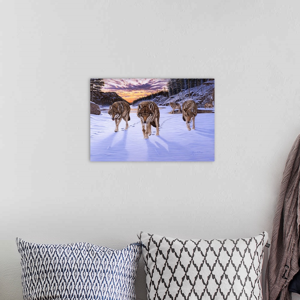 A bohemian room featuring Contemporary artwork of a pack of wolves in wintry scene at sunset.
