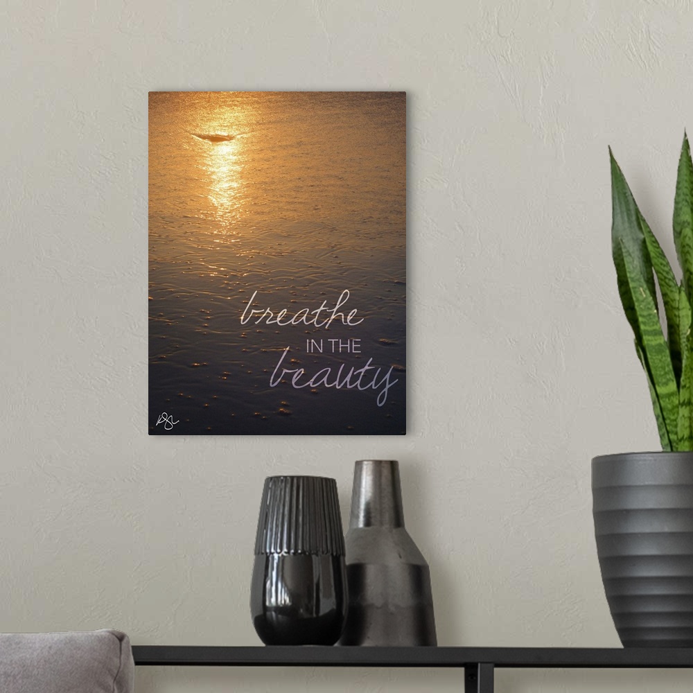 A modern room featuring Motivational text against background photograph of a seascape.