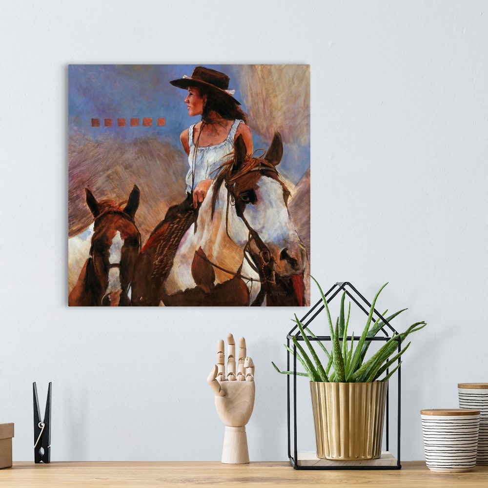 A bohemian room featuring Western themed contemporary painting of a cowgirl on horseback.