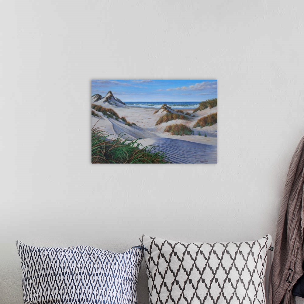 A bohemian room featuring Contemporary artwork of several grassy sand dunes on the beach.