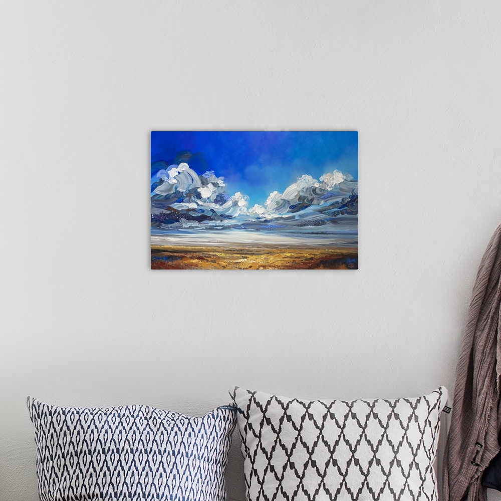 A bohemian room featuring Dramatic landscape painting of cloudy stormy sky over prairie field by contemporary Canadian Arti...