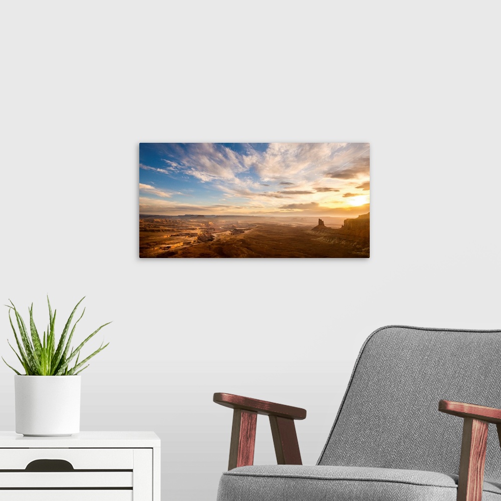 A modern room featuring Landscape photograph of canyons at sunrise.