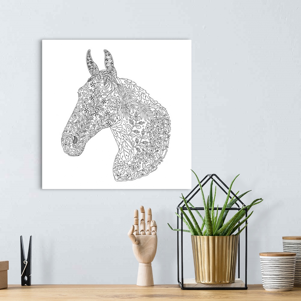 A bohemian room featuring Black and white line art of a horse made with an intricate floral design.