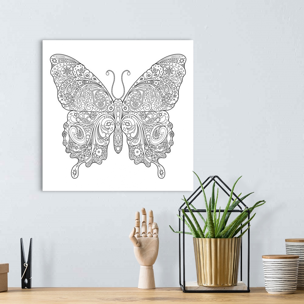 A bohemian room featuring Black and white line art of an intricately designed butterfly.